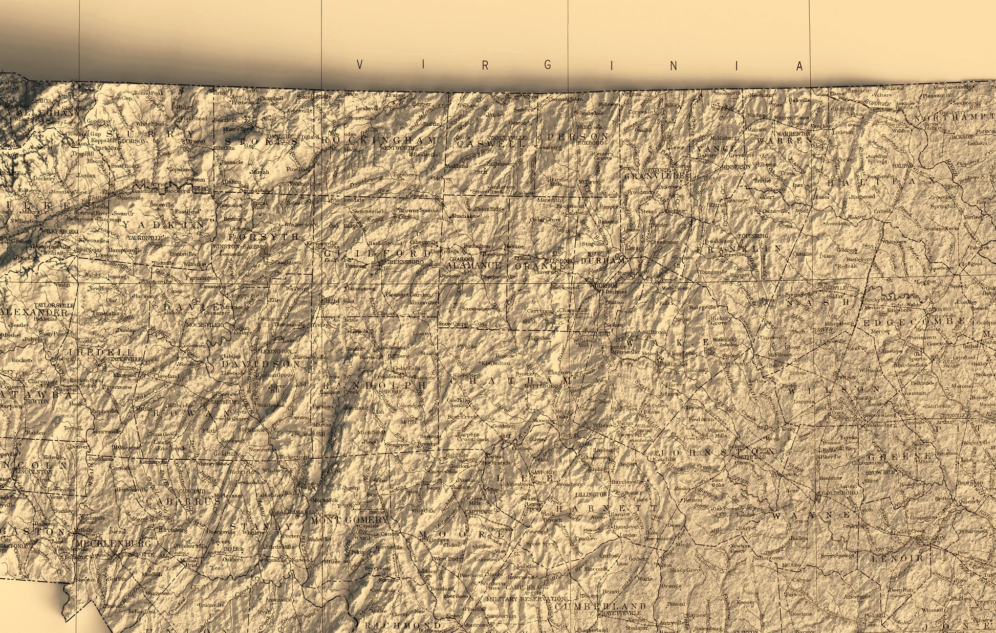 Detailed close-up of a vintage North Carolina (USA) relief map, showcasing textured topography and geographic contours