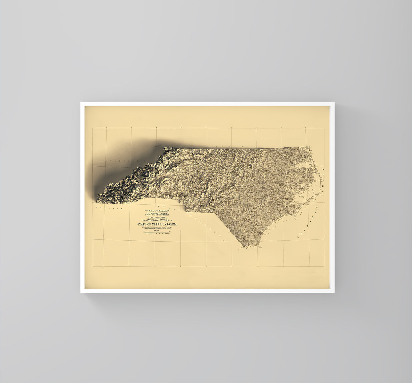 North Carolina (USA) vintage framed shaded relief map in white frame. Artistic print highlighting mountains with a realistic 3d effect