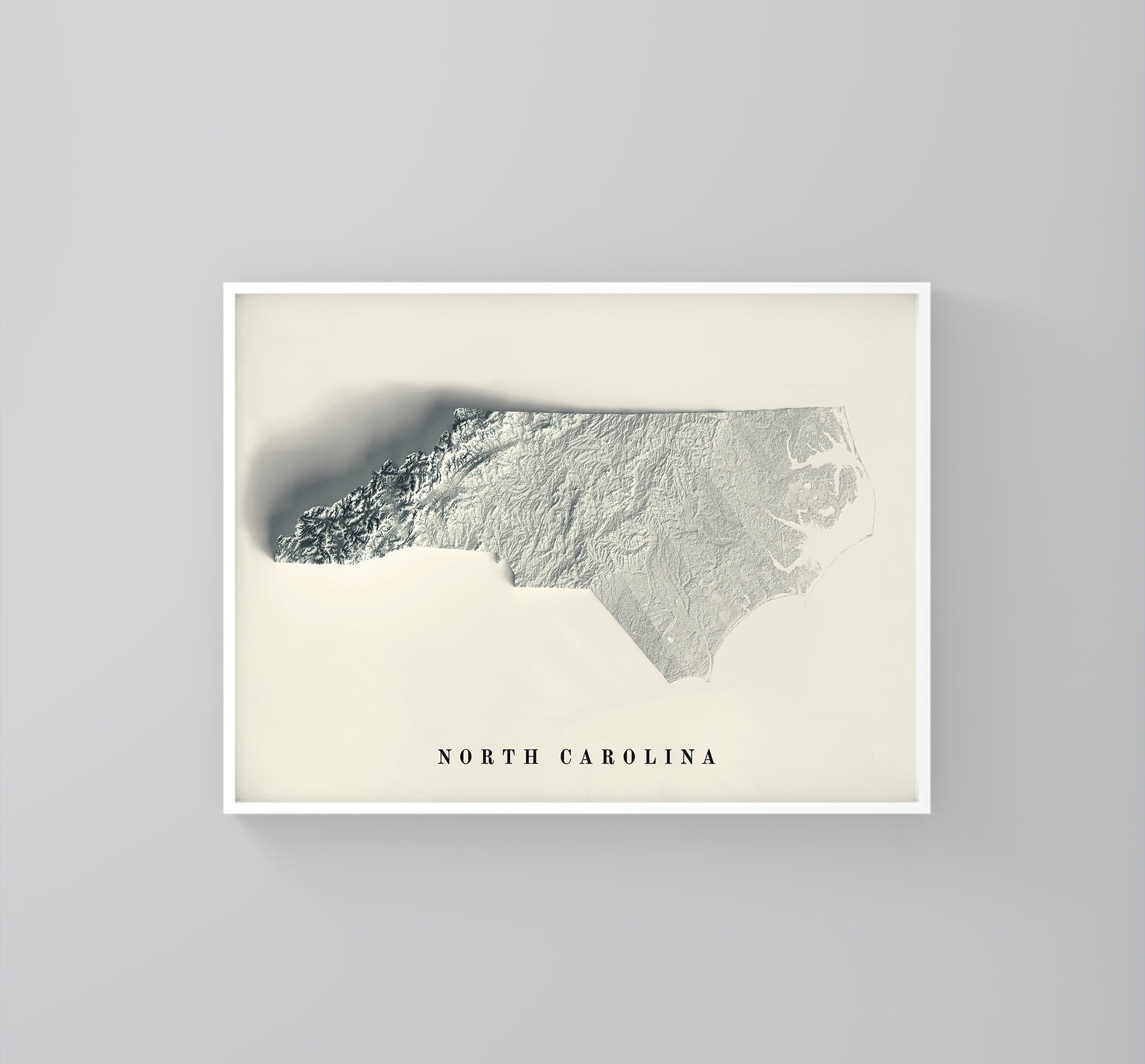 North Carolina (USA) framed shaded relief map in white frame. Artistic print highlighting mountains with a realistic 3d effect