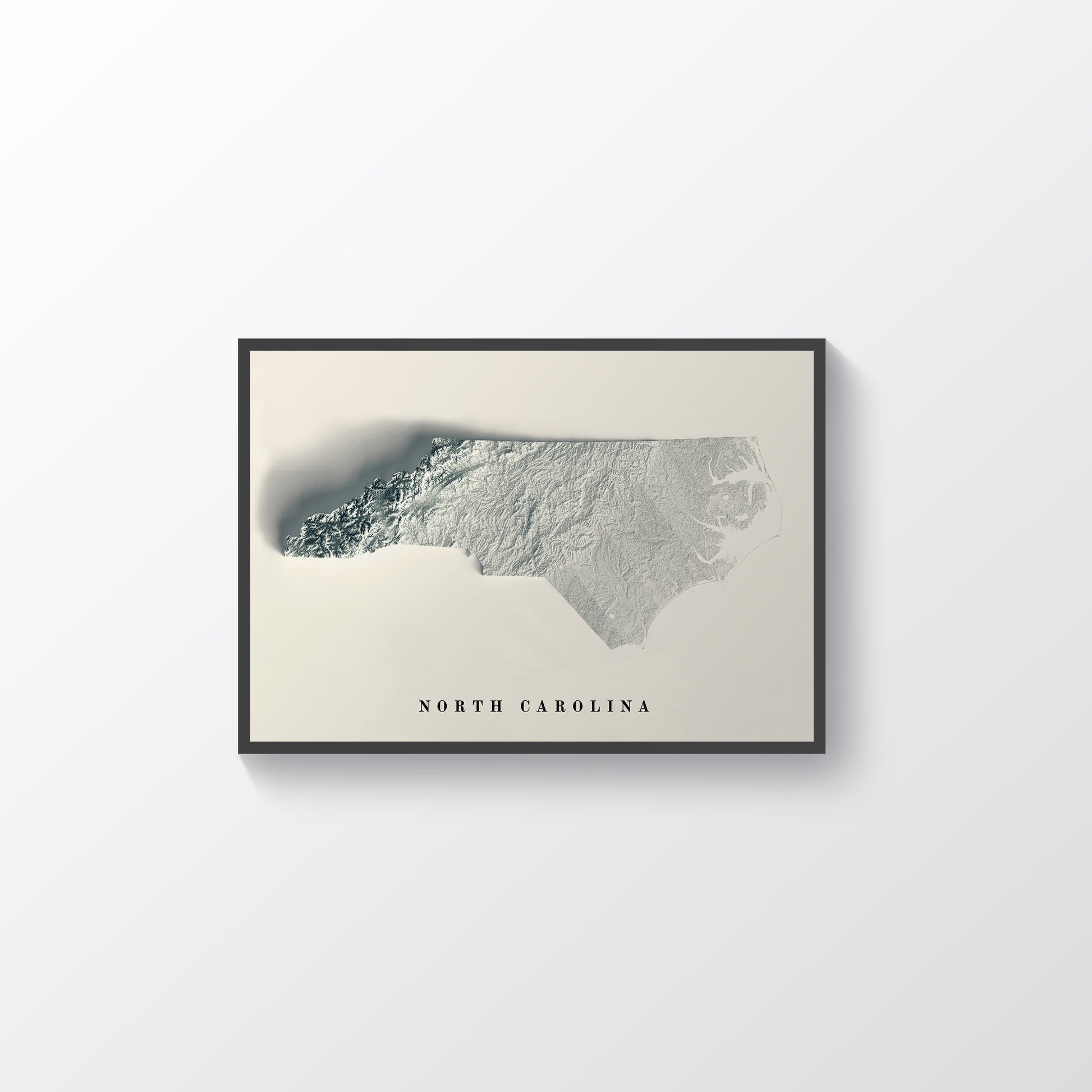 North Carolina (USA) framed shaded relief map in black frame. Artistic print highlighting mountains with a realistic terrain effect