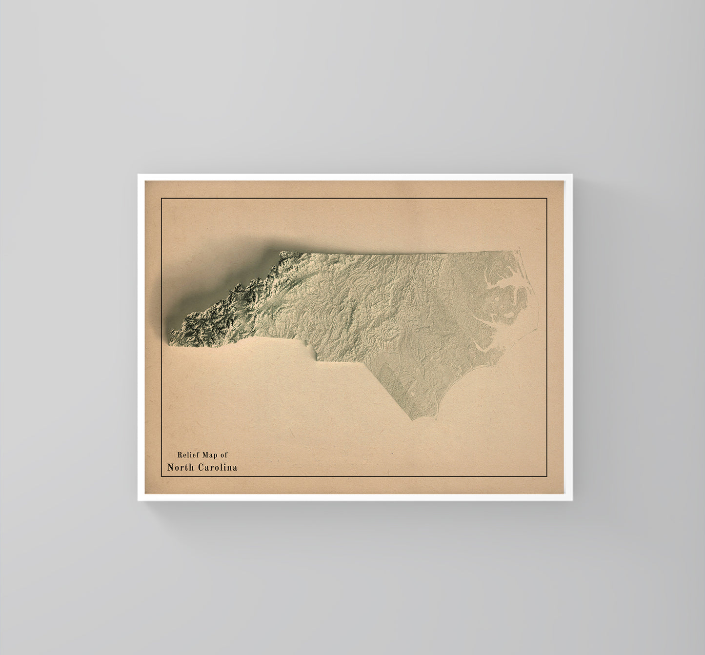 North Carolina (USA) vintage framed shaded relief map in white frame. Artistic print highlighting mountains with a realistic 3d effect