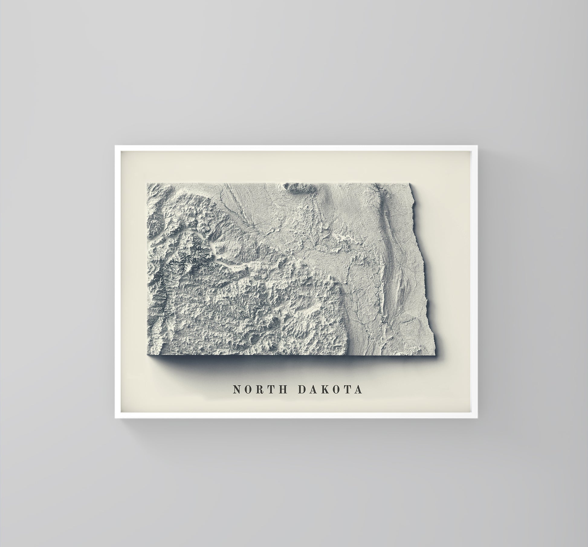 North Dakota (USA) framed shaded relief map in white frame. Artistic print highlighting mountains with a realistic 3d effect