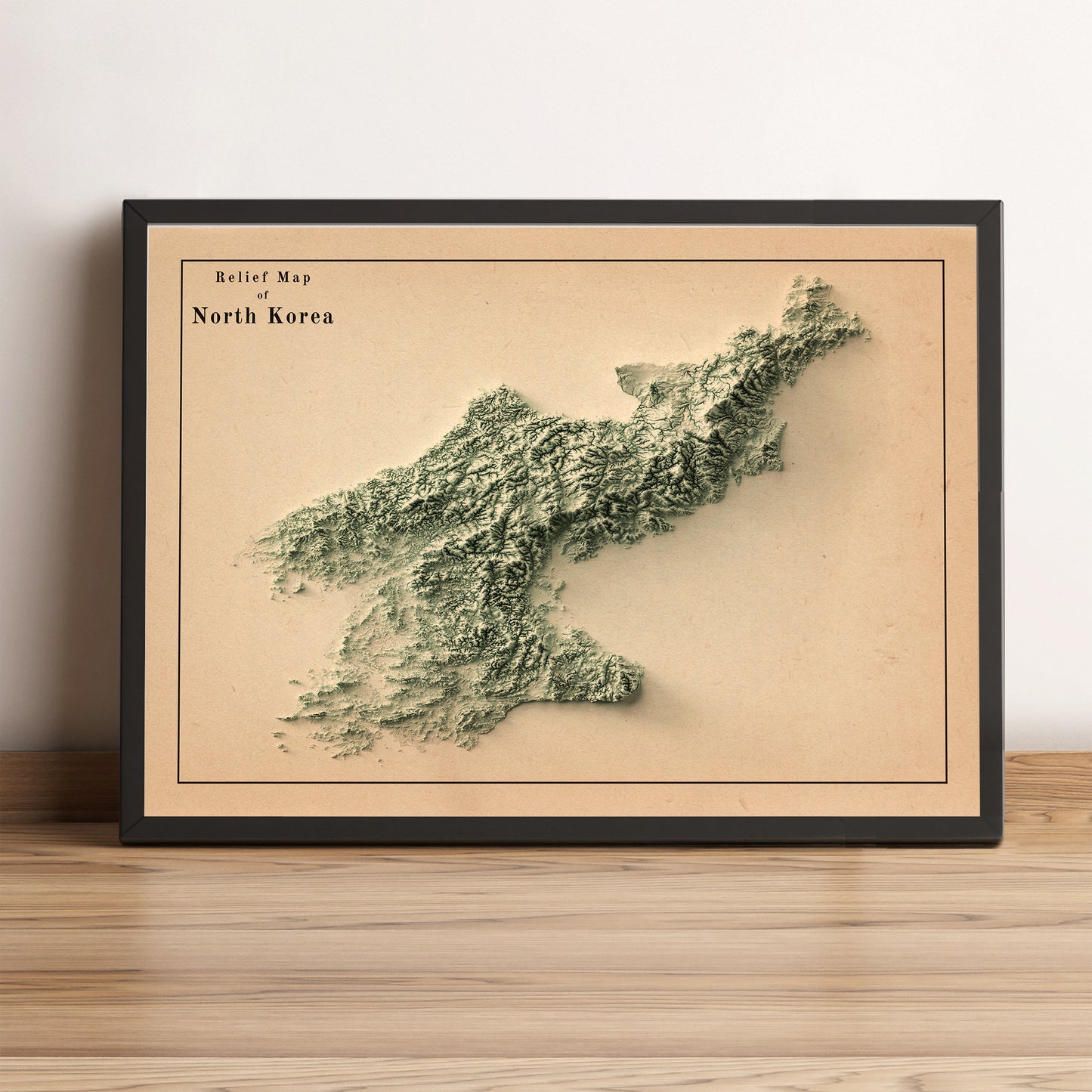 North Korea vintage framed shaded relief map in black frame. Artistic print highlighting mountains with a realistic terrain effect