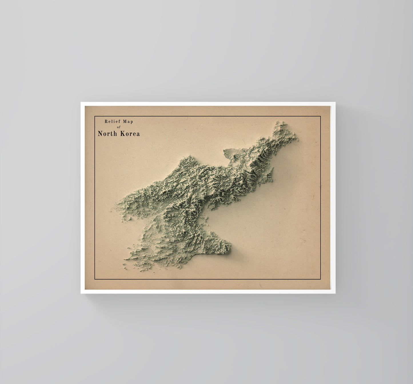 North Korea vintage framed shaded relief map in white frame. Artistic print highlighting mountains with a realistic 3d effect