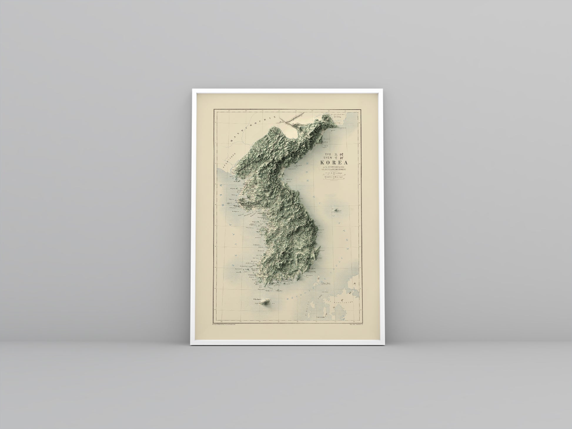 North and South Koreas vintage framed shaded relief map in white frame. Artistic print highlighting mountains with a realistic 3d effect