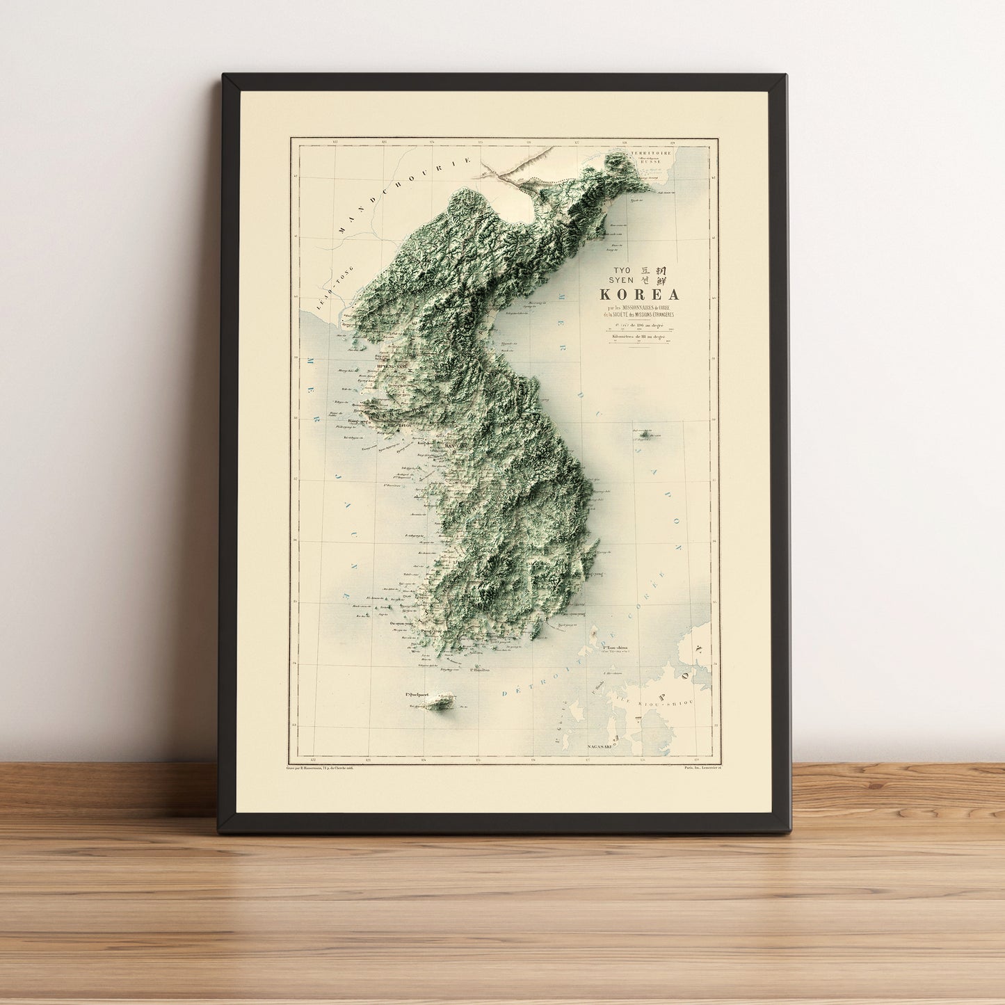 North & South Koreas vintage framed shaded relief map in black frame. Artistic print highlighting mountains with a realistic terrain effect