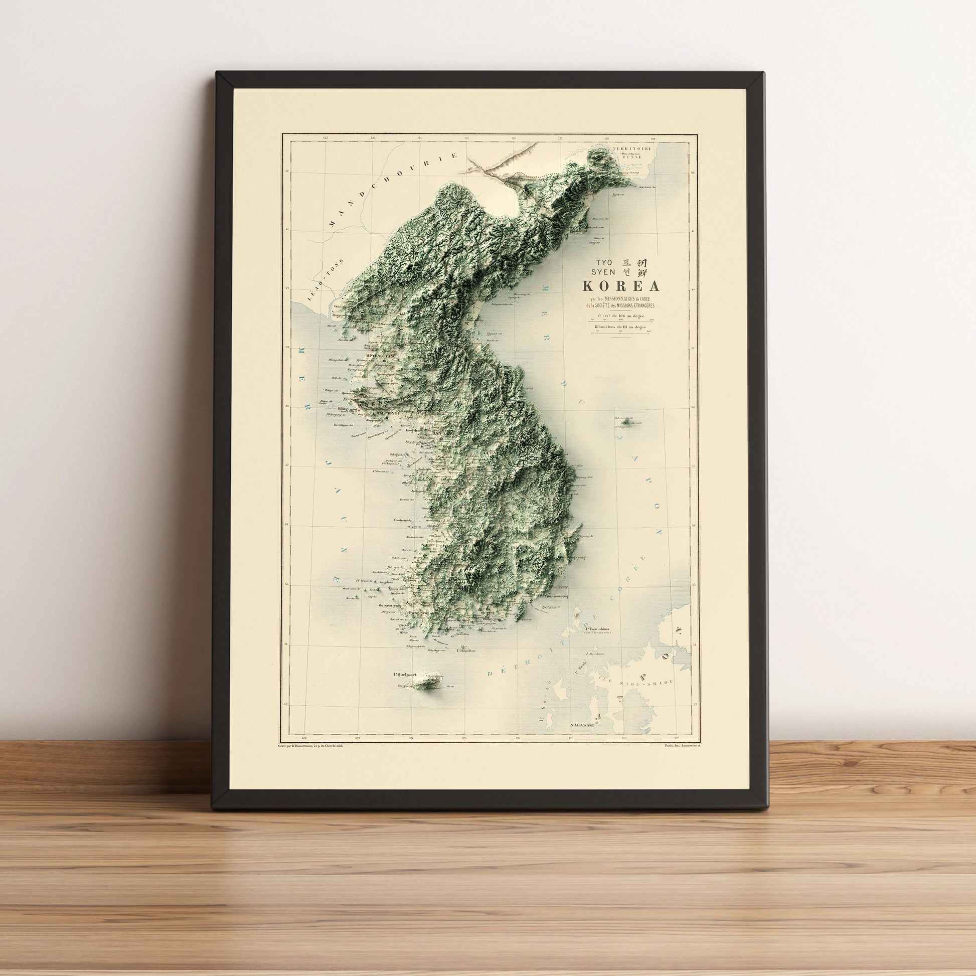 North & South Koreas vintage framed shaded relief map in black frame. Artistic print highlighting mountains with a realistic terrain effect