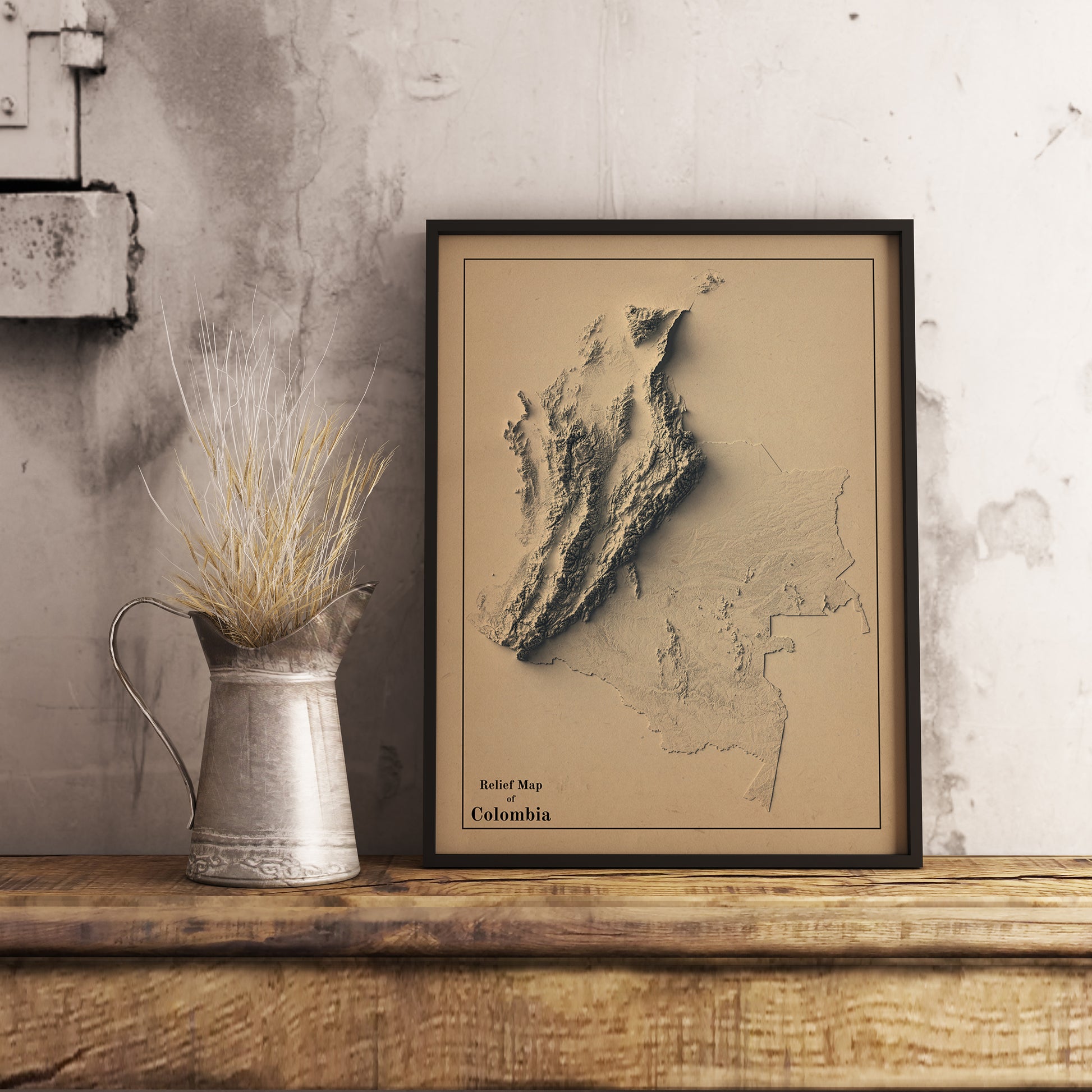 Vintage Colombia shaded relief map in black frame. Realistic terrain art print for home decor, displayed on rustic wooden table