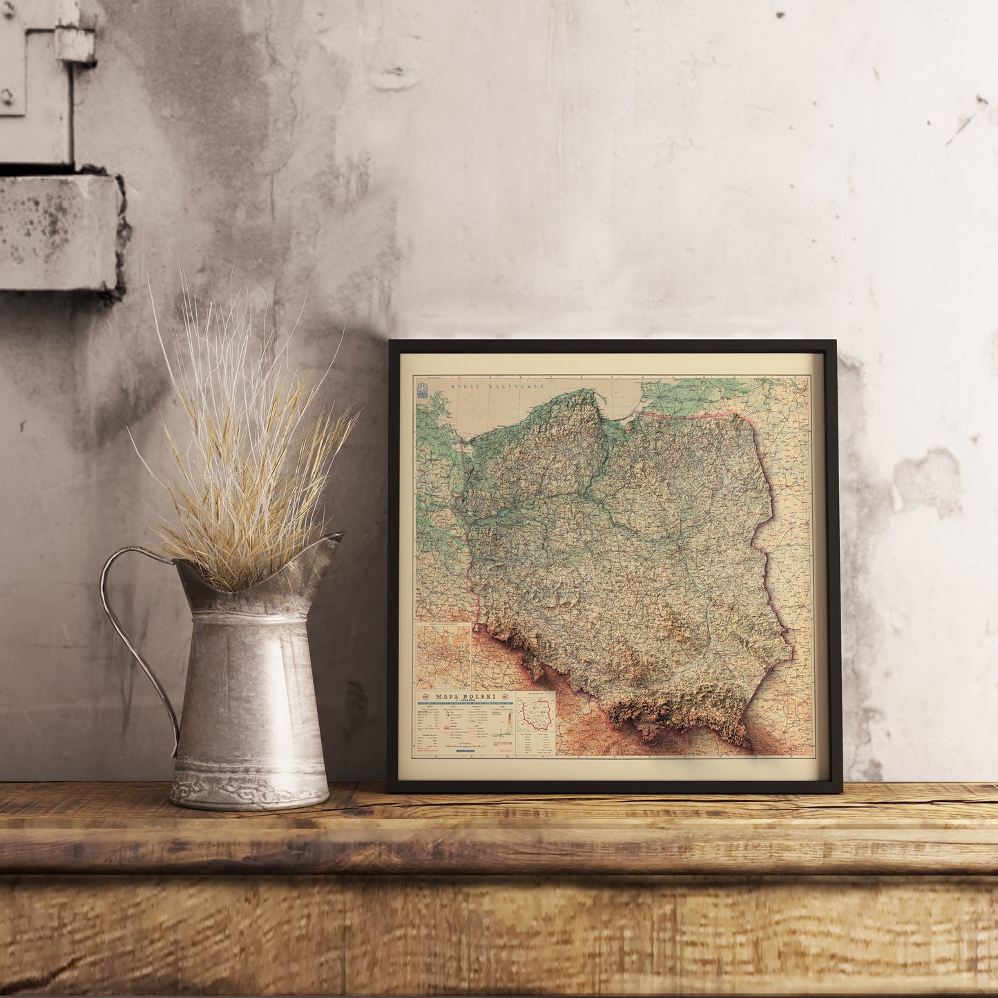 Vintage Poland shaded relief map in black frame. Realistic terrain art print for home decor, displayed on rustic wooden table