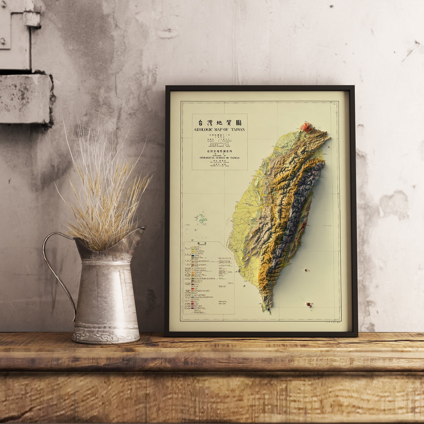 Vintage Taiwan shaded relief map in black frame. Realistic terrain art print for home decor, displayed on rustic wooden table
