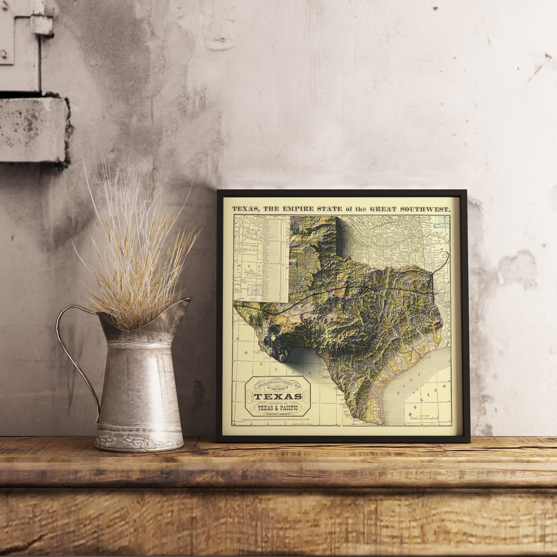 Vintage Texas (USA) shaded relief map in black frame. Realistic terrain art print for home decor, displayed on rustic wooden table