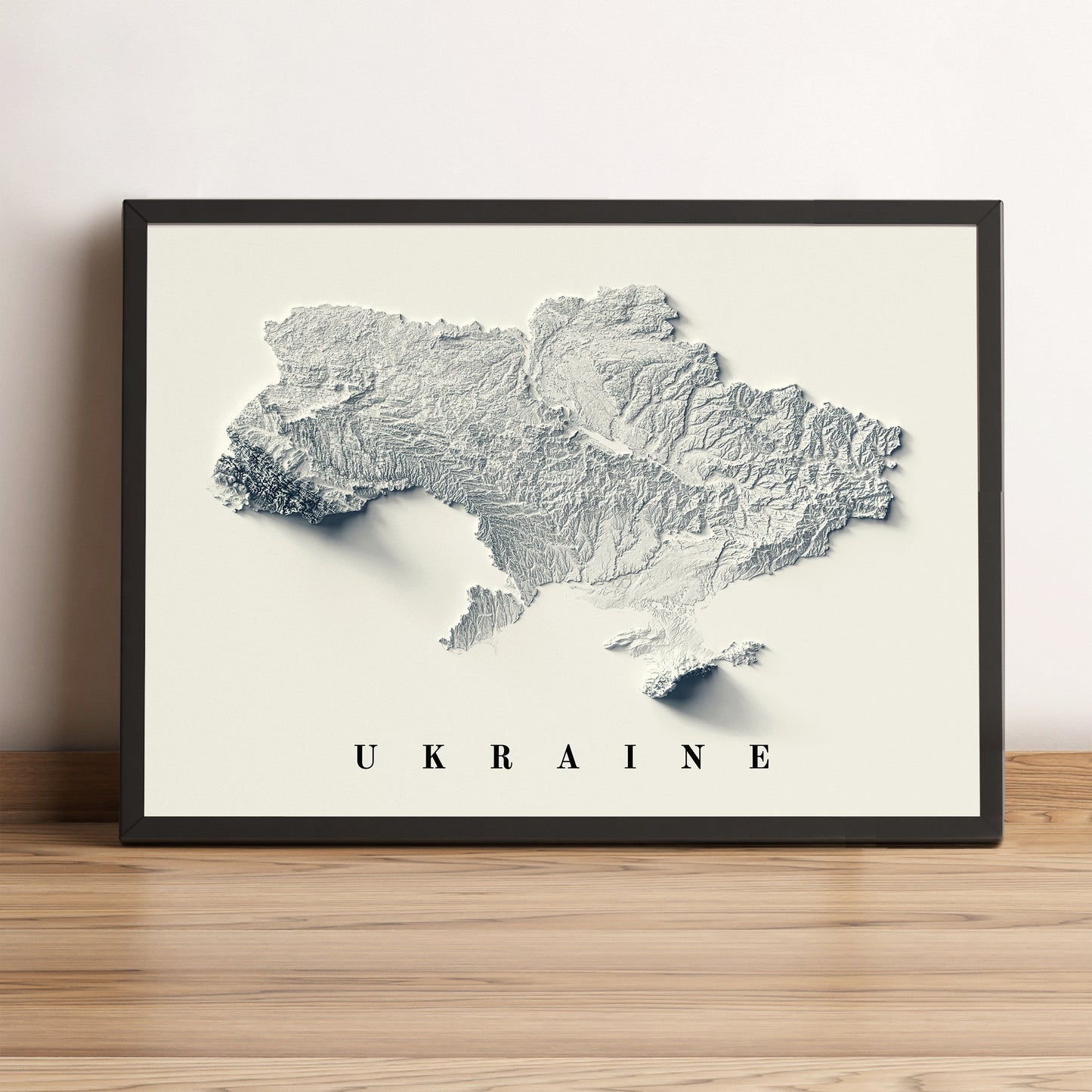 Ukraine framed shaded relief map in black frame. Artistic print highlighting mountains with a realistic terrain effect