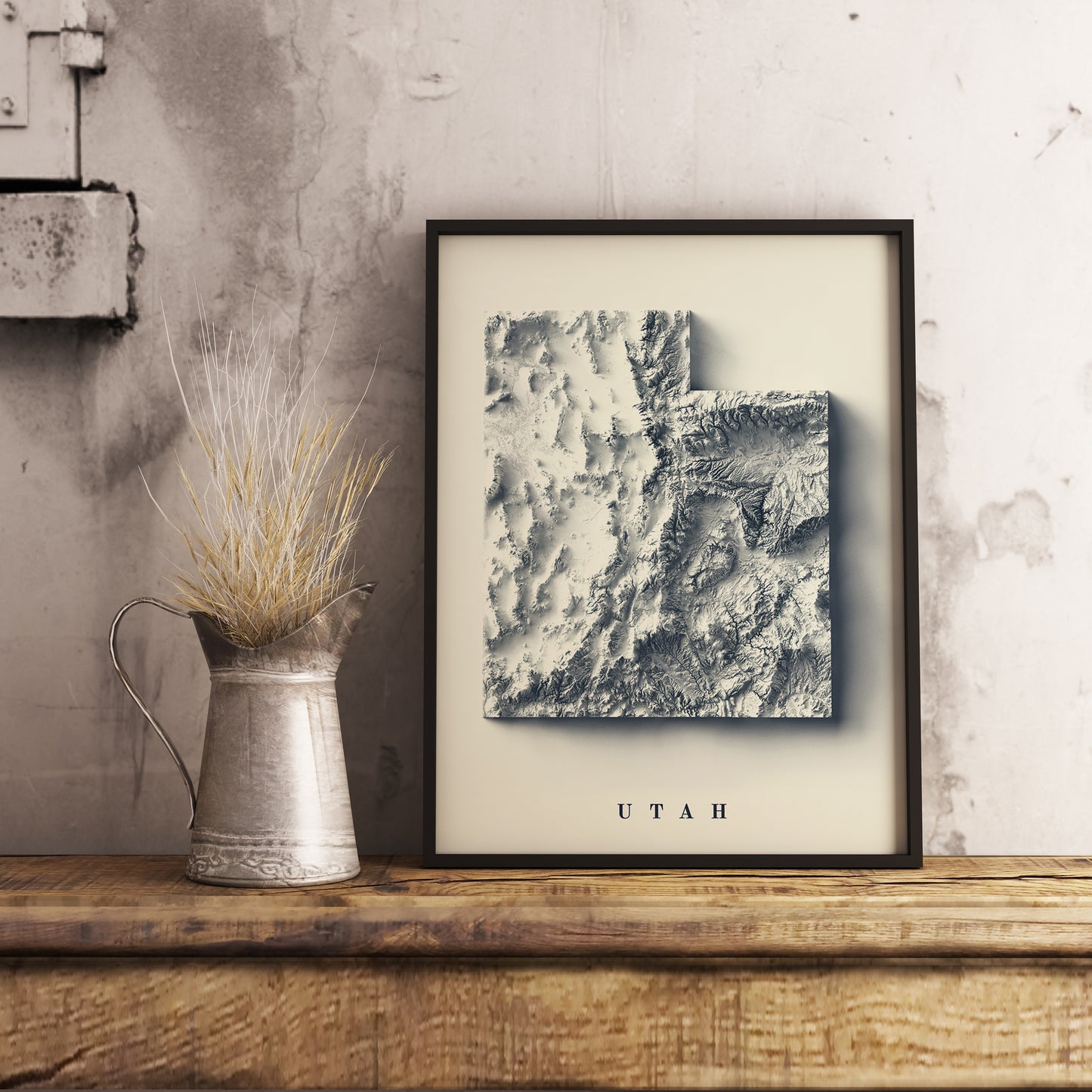 Utah (USA) shaded relief map in black frame. Realistic terrain art print for home decor, displayed on rustic wooden table