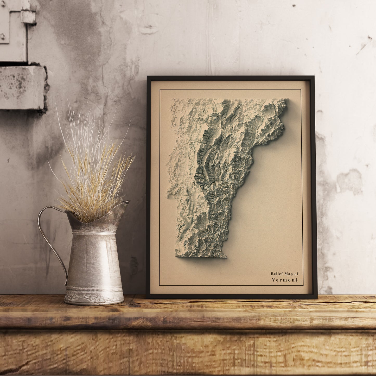 Vintage Vermont (USA) shaded relief map in black frame. Realistic terrain art print for home decor, displayed on rustic wooden table