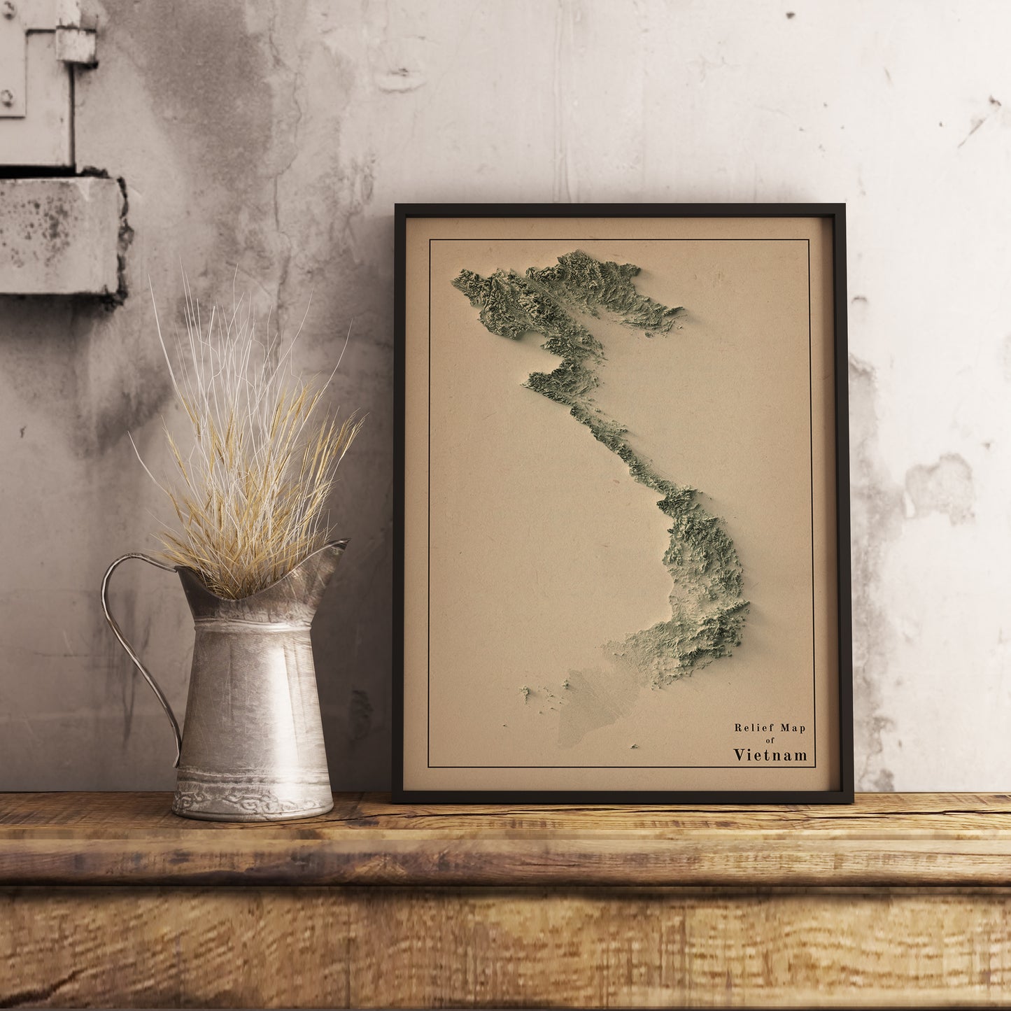Vintage Vietnam shaded relief map in black frame. Realistic terrain art print for home decor, displayed on rustic wooden table
