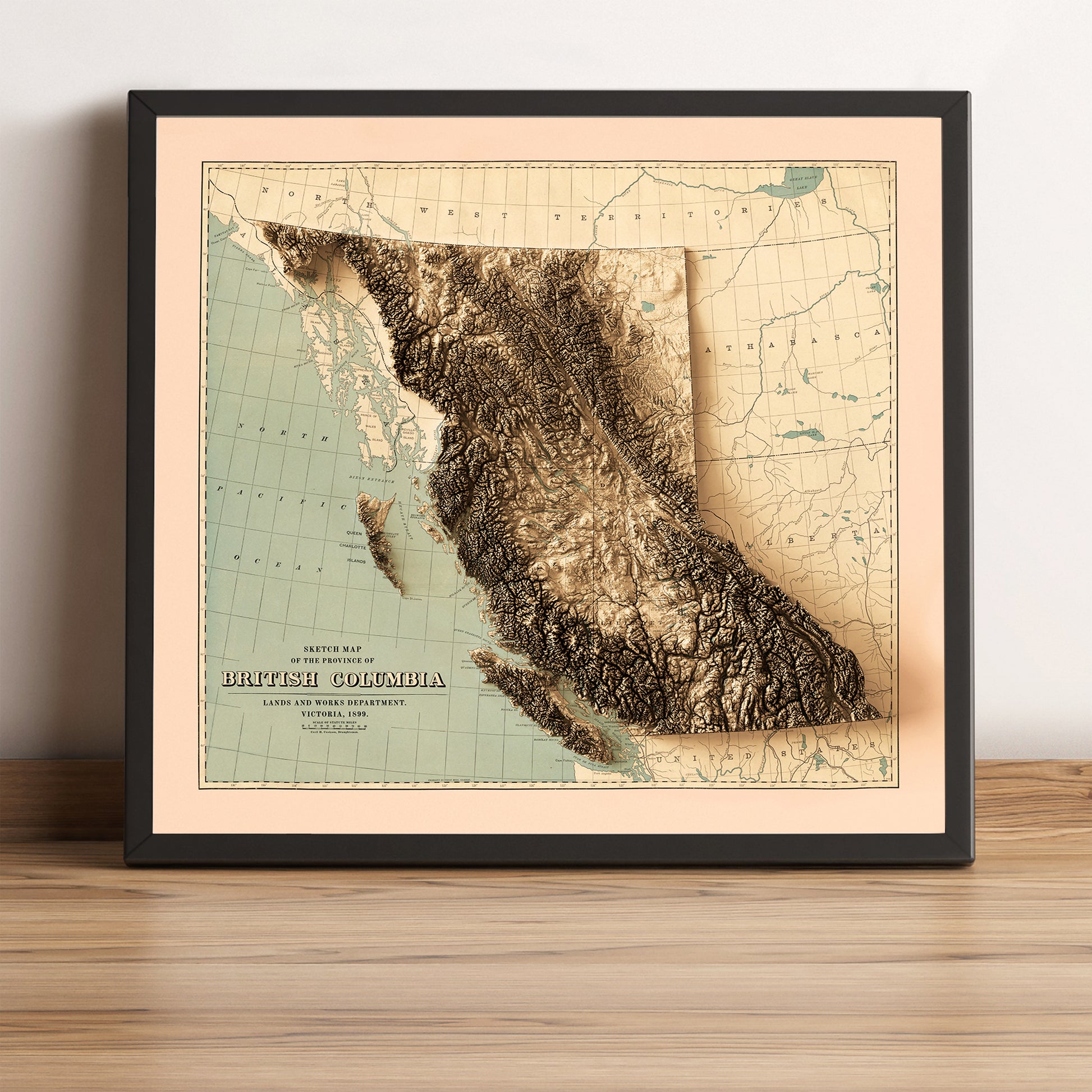British Columbia (Canada) vintage framed shaded relief map in black frame. Artistic print highlighting mountains with a realistic terrain effect