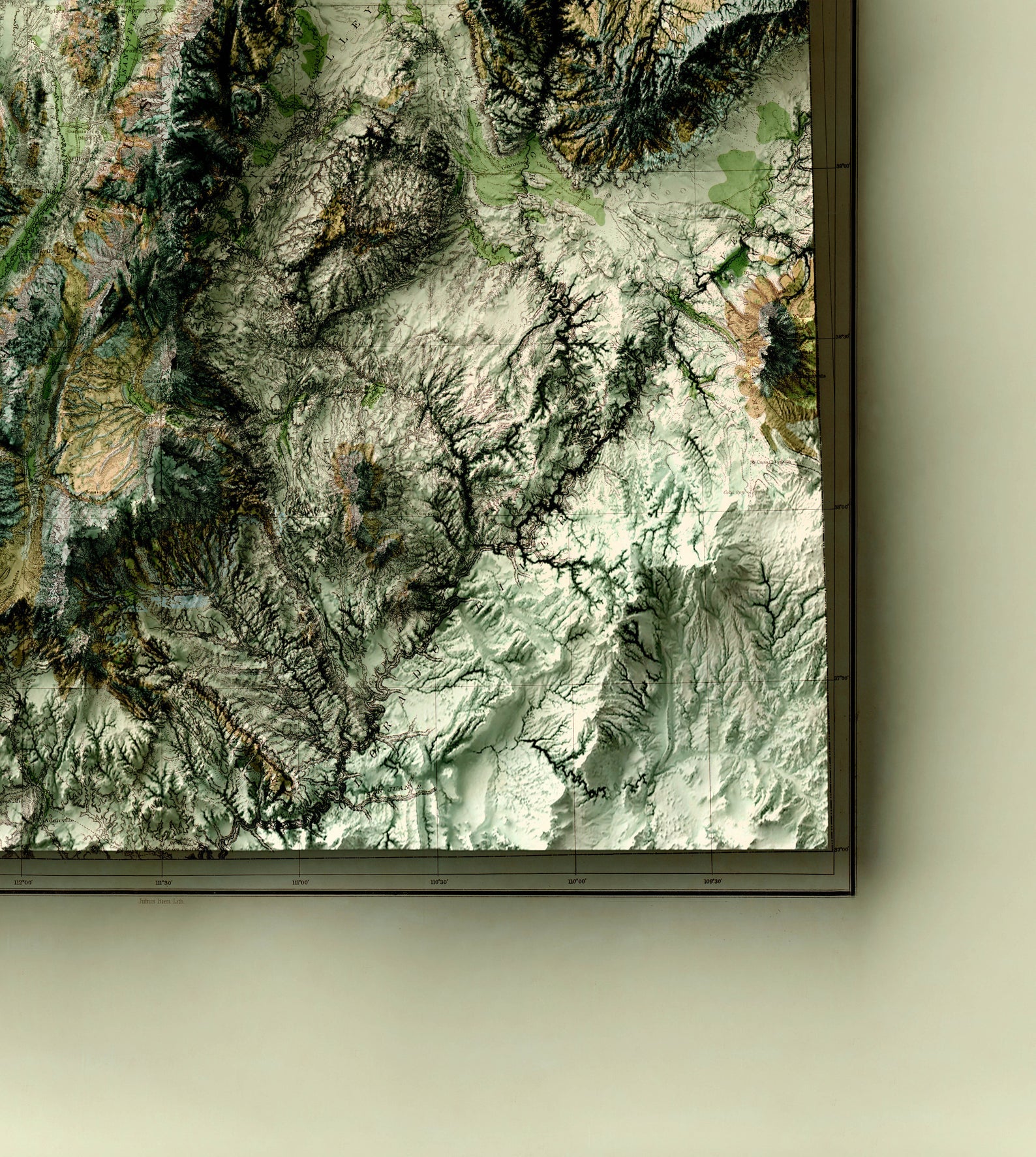 Detailed close-up of a vintage Utah (USA) relief map, showcasing textured topography and geographic contours