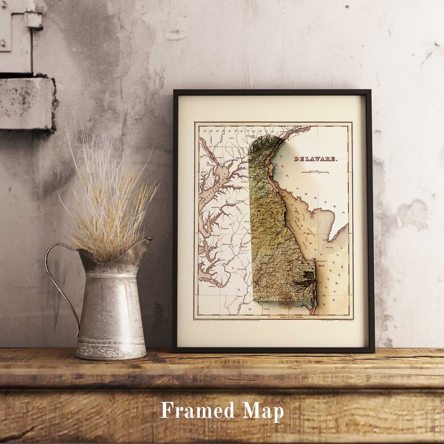 Vintage Delaware (USA) shaded relief map in black frame. Realistic terrain art print for home decor, displayed on rustic wooden table