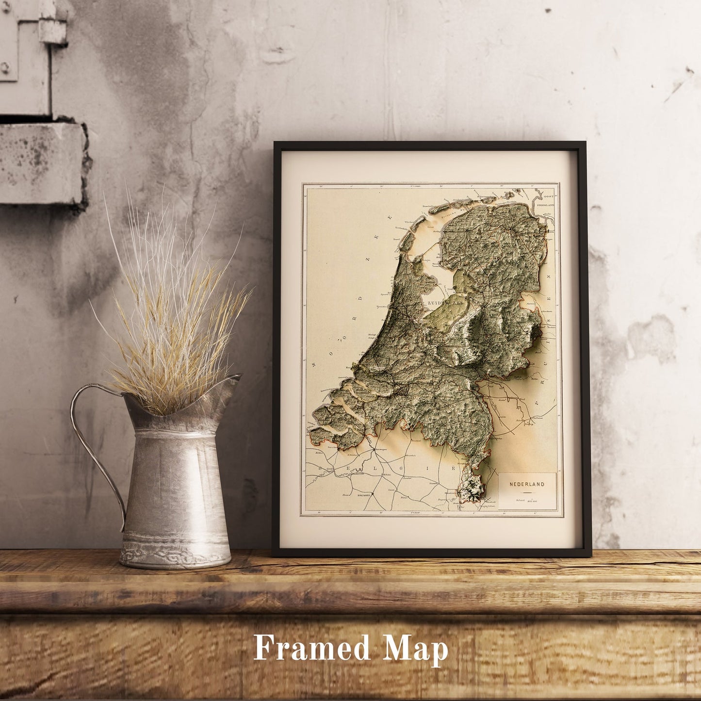 Vintage Netherlands shaded relief map in black frame. Realistic terrain art print for home decor, displayed on rustic wooden table