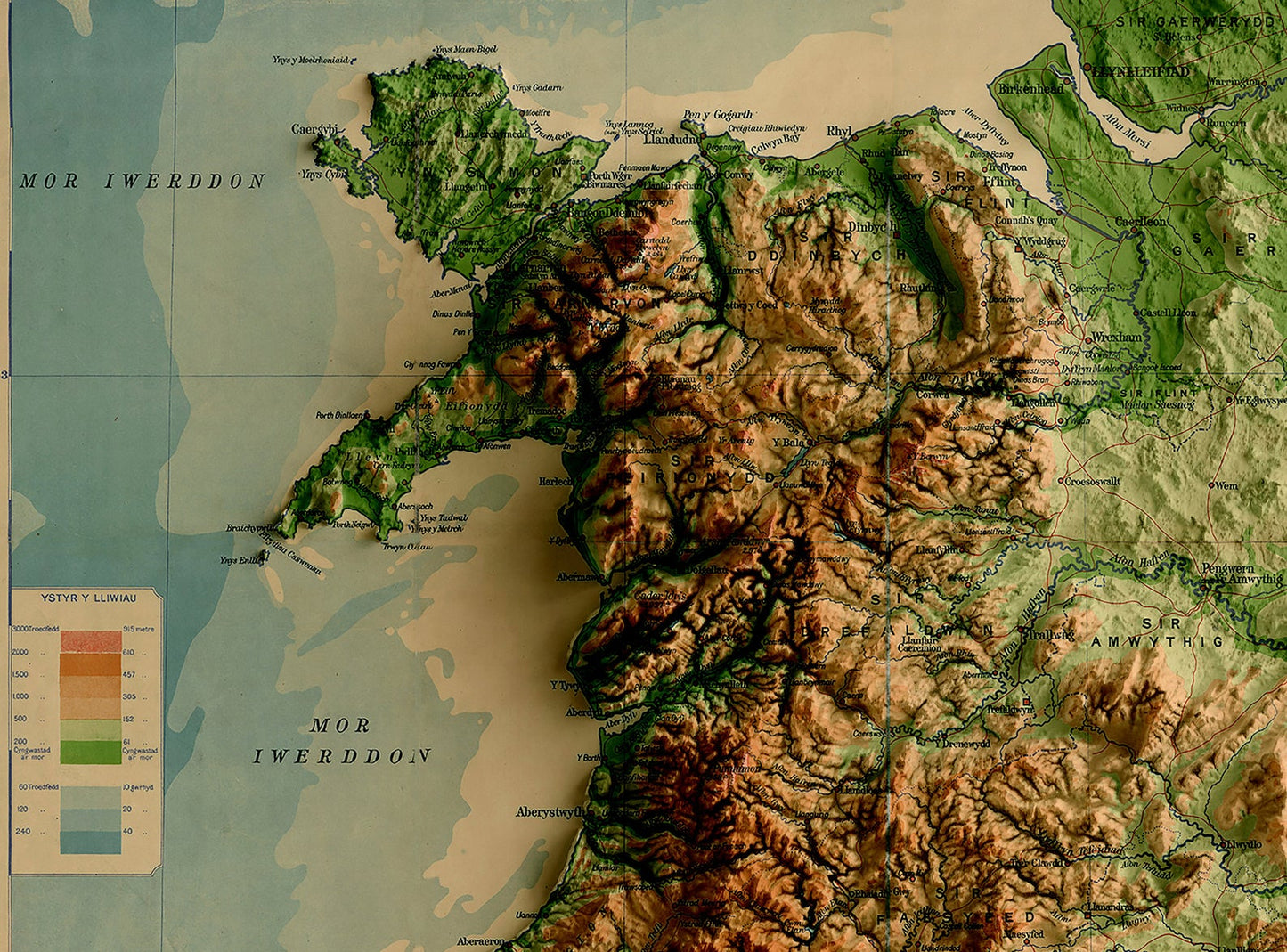 Detailed close-up of a vintage Wales relief map, showcasing textured topography and geographic contours