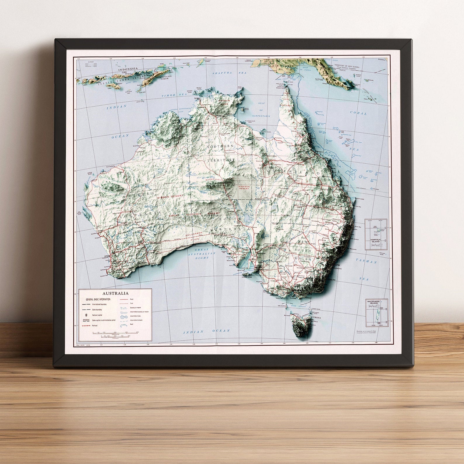 Australia vintage framed shaded relief map in black frame. Artistic print highlighting mountains with a realistic terrain effect