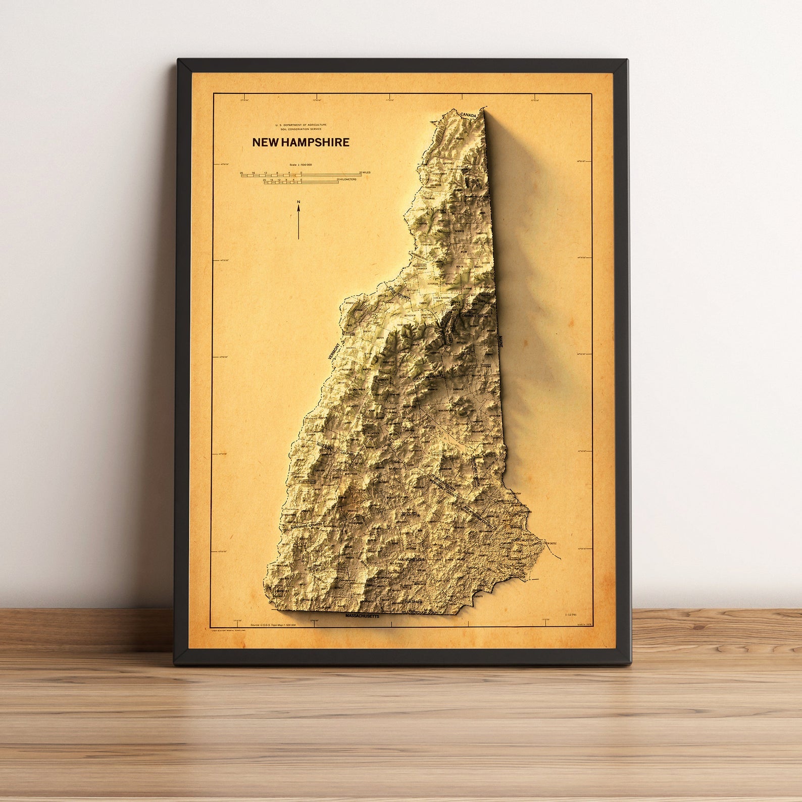 New Hampshire (USA) vintage framed shaded relief map in black frame. Artistic print highlighting mountains with a realistic terrain effect