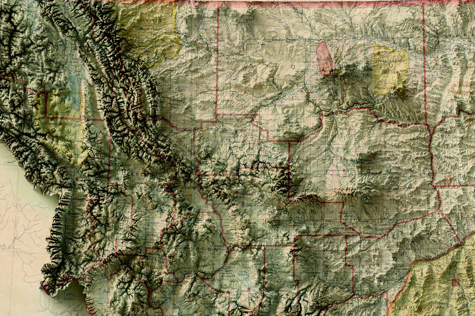 Detailed close-up of a vintage Montana (USA) relief map, showcasing textured topography and geographic contours