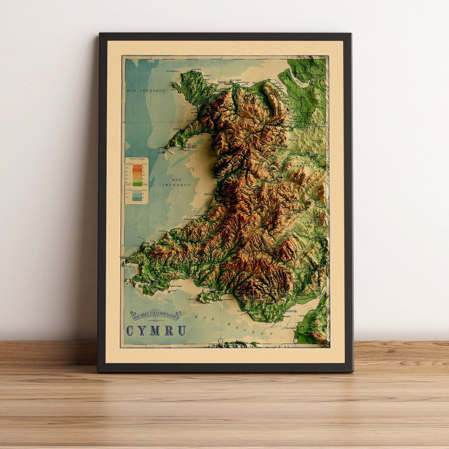 Wales vintage framed shaded relief map in black frame. Artistic print highlighting mountains with a realistic terrain effect
