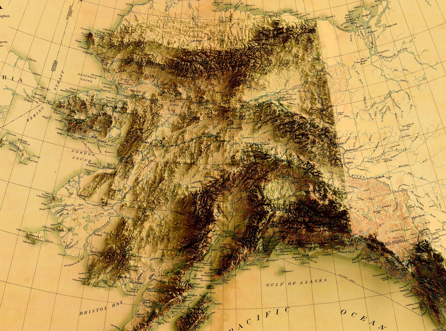 Detailed close-up of a vintage Alaska (USA) relief map, showcasing textured topography and geographic contours