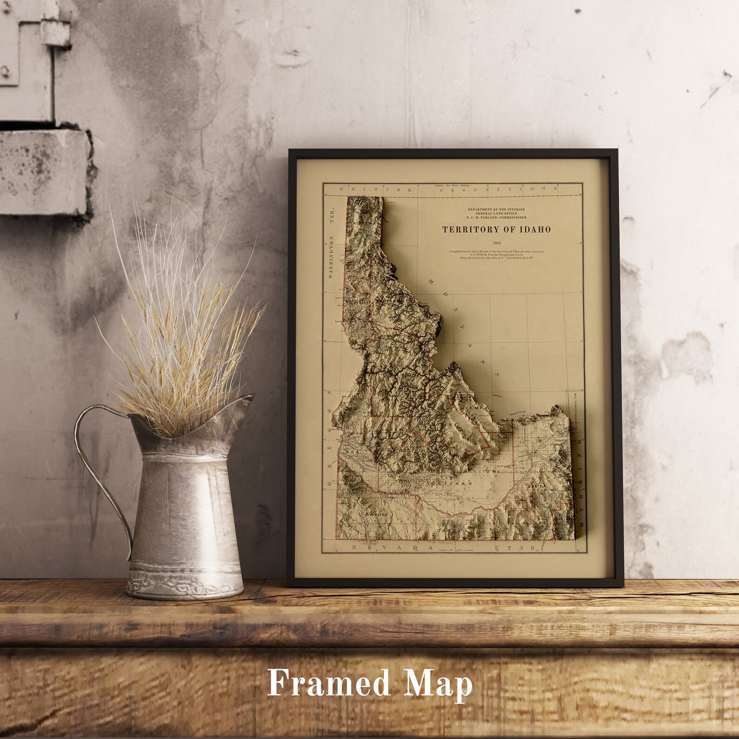Vintage Idaho (USA) shaded relief map in black frame. Realistic terrain art print for home decor, displayed on rustic wooden table