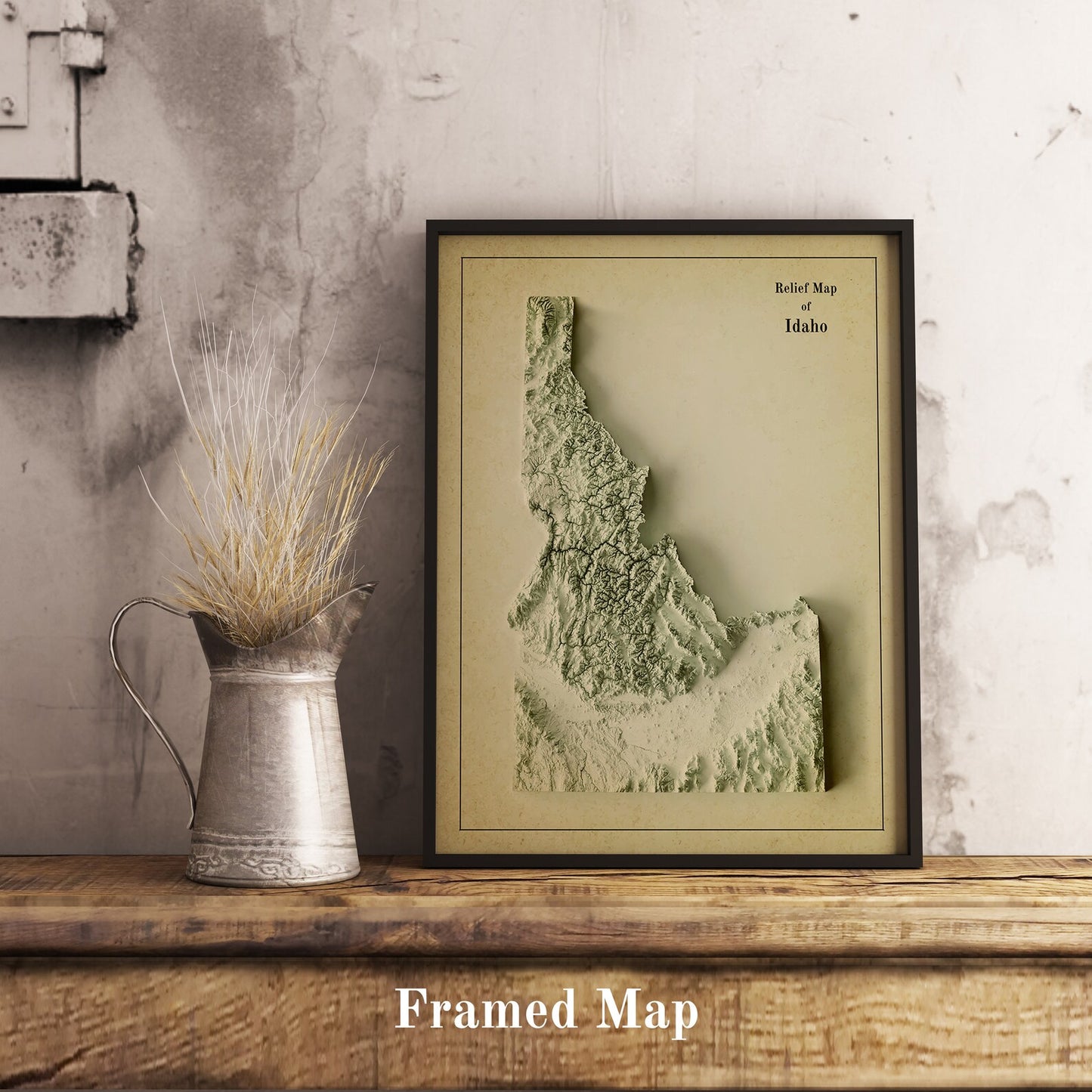 Vintage Idaho (USA) shaded relief map in black frame. Realistic terrain art print for home decor, displayed on rustic wooden table