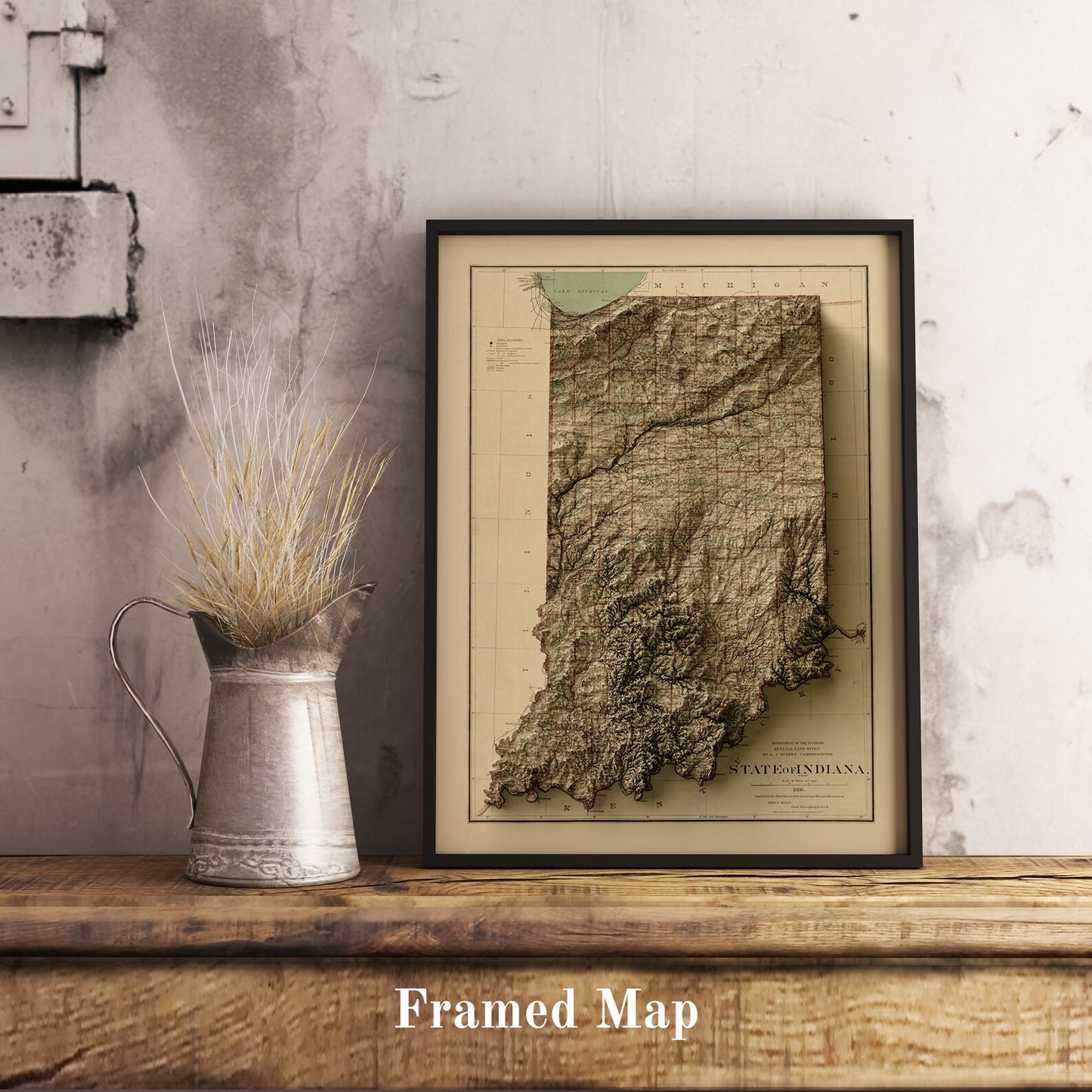 Vintage Indiana (USA) shaded relief map in black frame. Realistic terrain art print for home decor, displayed on rustic wooden table