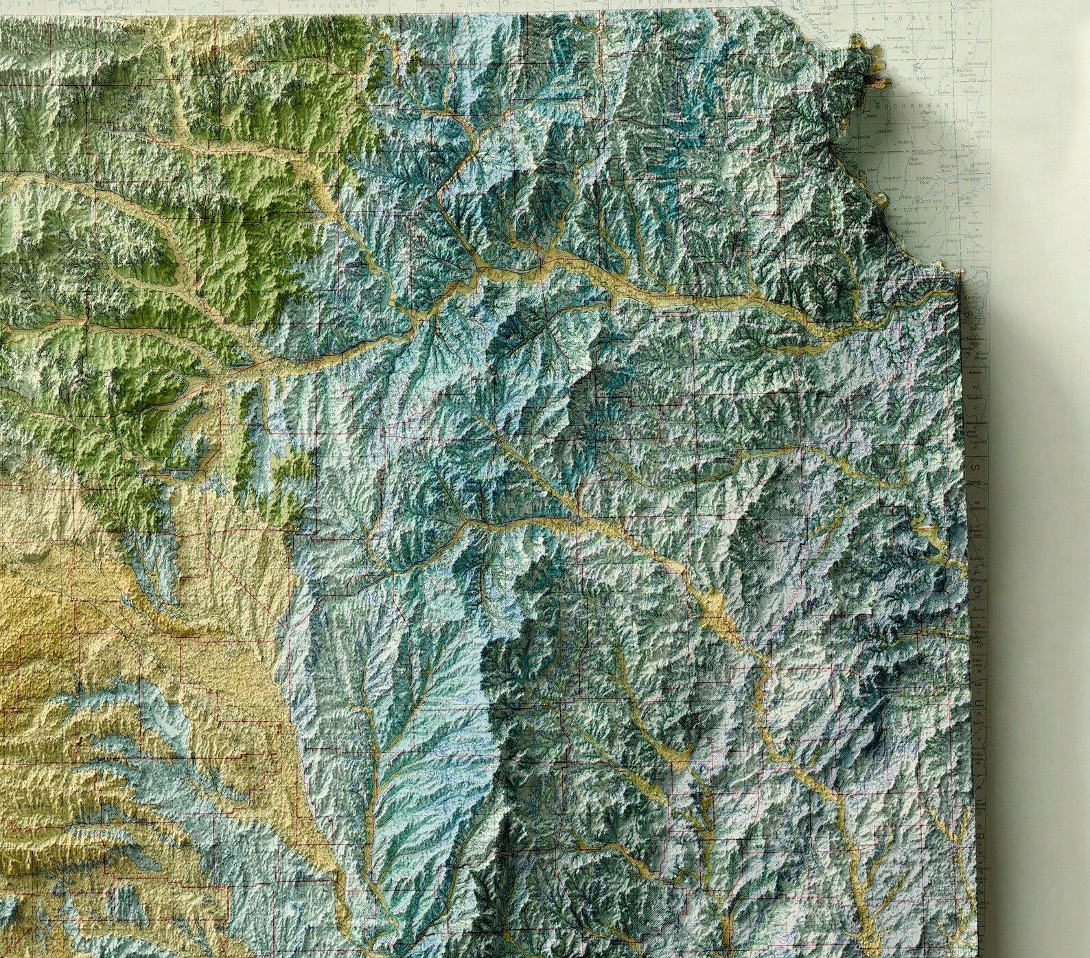 Detailed close-up of a vintage Japan relief map, showcasing textured topography and geographic contours