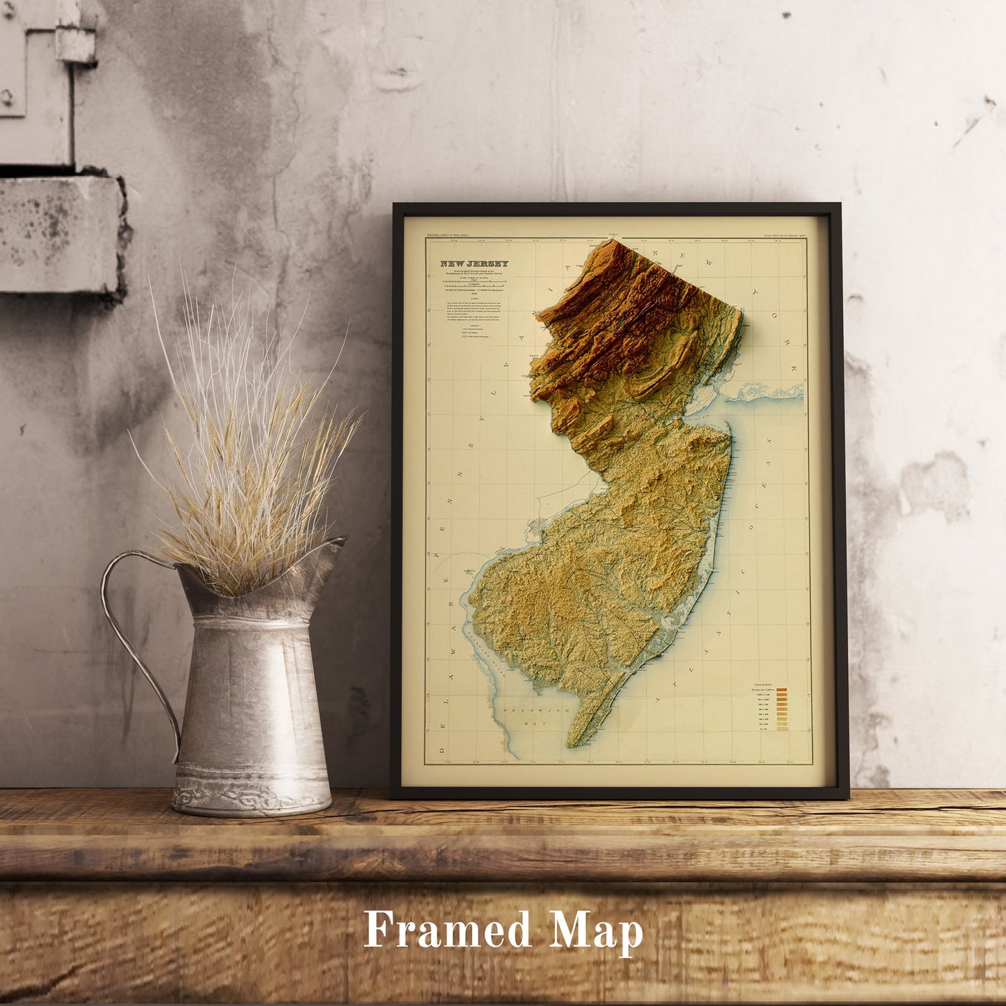 Vintage New Jersey (USA) shaded relief map in black frame. Realistic terrain art print for home decor, displayed on rustic wooden table