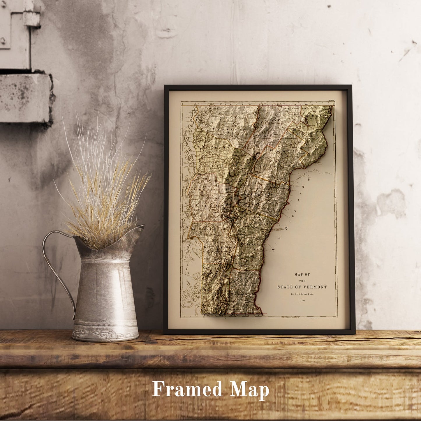 Vintage Vermont (USA) shaded relief map in black frame. Realistic terrain art print for home decor, displayed on rustic wooden table