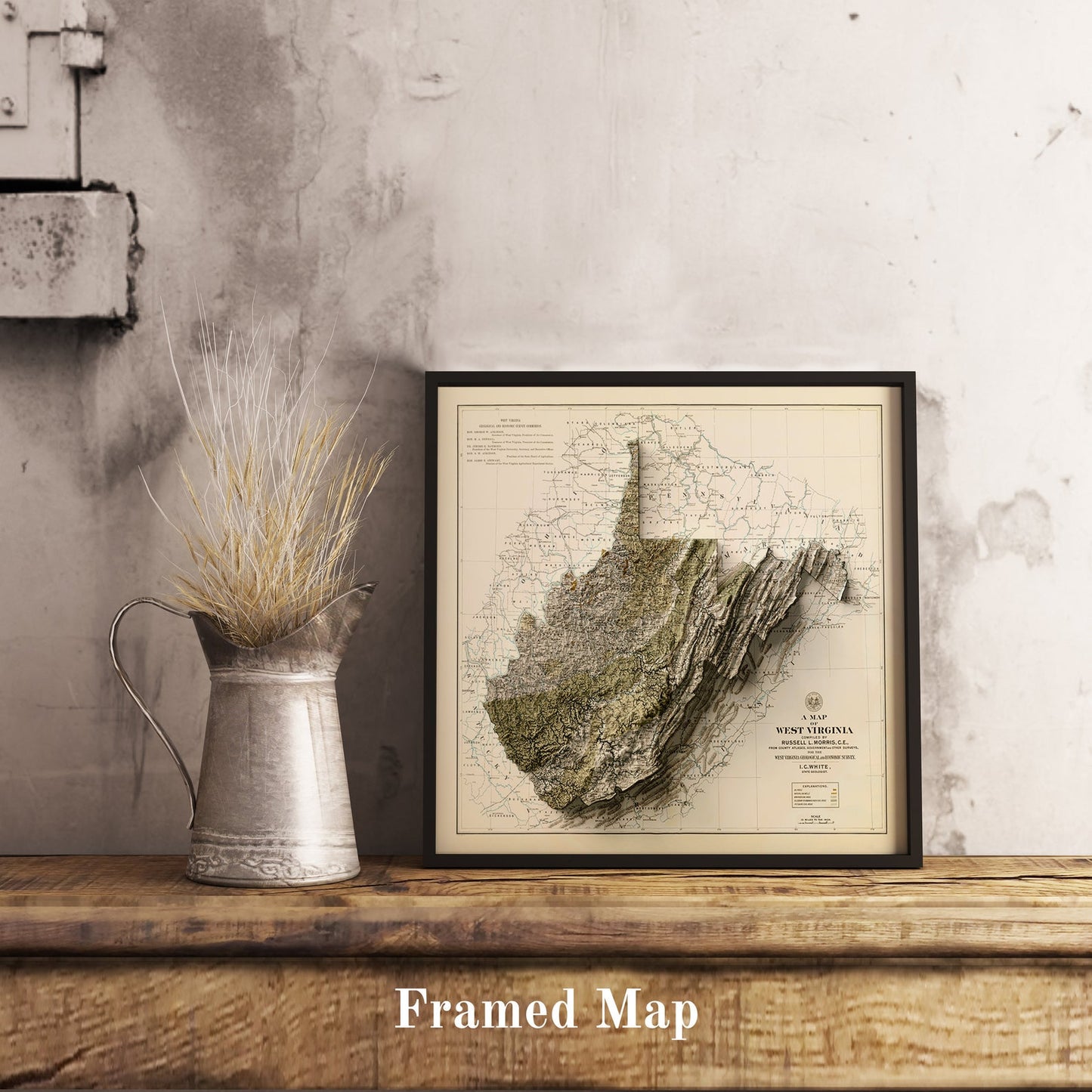 Vintage West Virginia (USA) shaded relief map in black frame. Realistic terrain art print for home decor, displayed on rustic wooden table