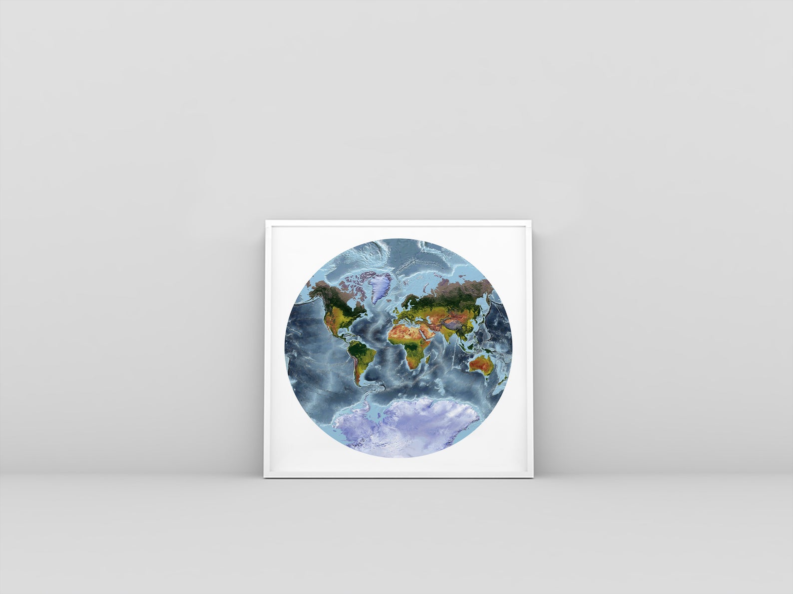 World framed shaded relief map in white frame. Van der Grinten Projection, an artistic print highlighting mountains and vegetation