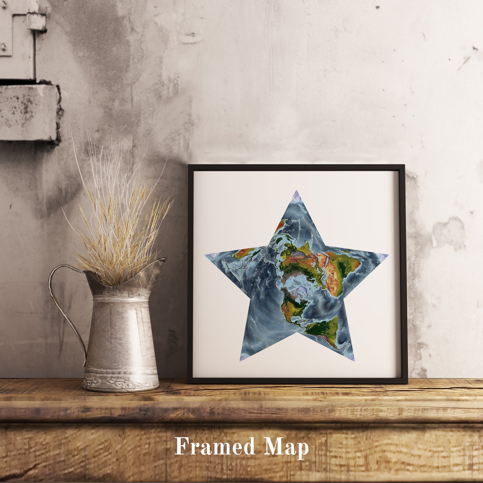 World shaded relief map in black frame, featuring the Berghaus Projection. Terrain art print for home decor, displayed on rustic wooden table