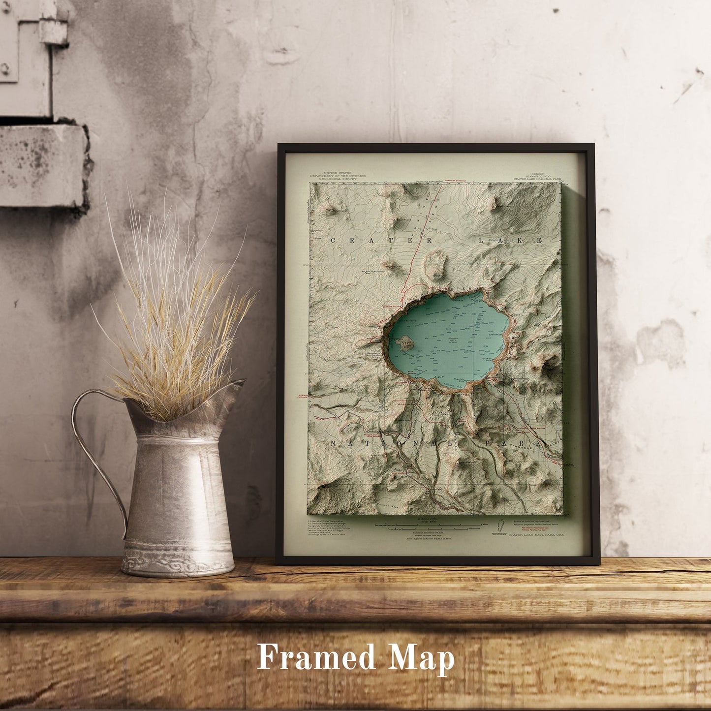 Vintage Crater Lake (USA) shaded relief map in black frame. Realistic terrain art print for home decor, displayed on rustic wooden table
