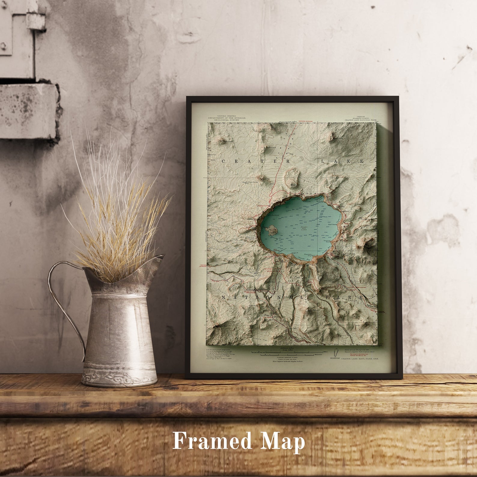 Vintage Crater Lake (USA) shaded relief map in black frame. Realistic terrain art print for home decor, displayed on rustic wooden table