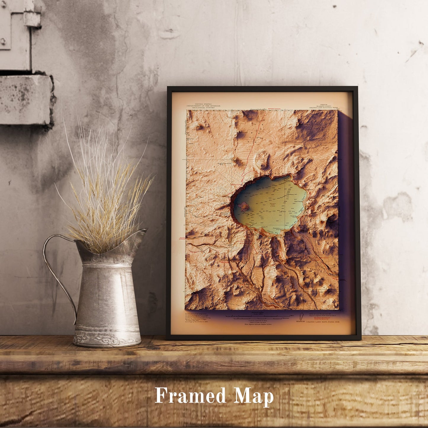 Vintage Crater Lake (USA) shaded relief map in black frame. Realistic terrain art print for home decor, displayed on rustic wooden table