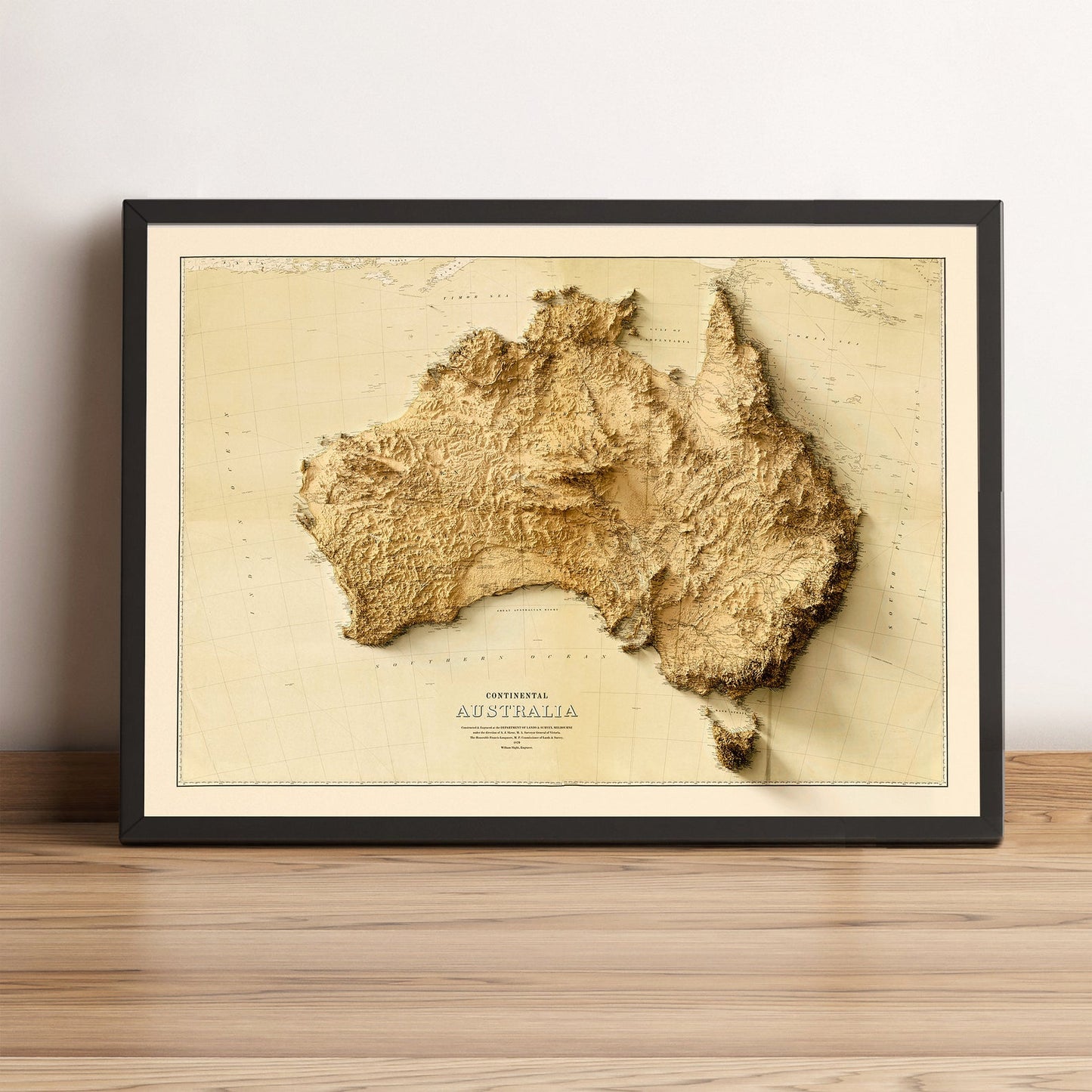 Australia vintage framed shaded relief map in black frame. Artistic print highlighting mountains with a realistic terrain effect