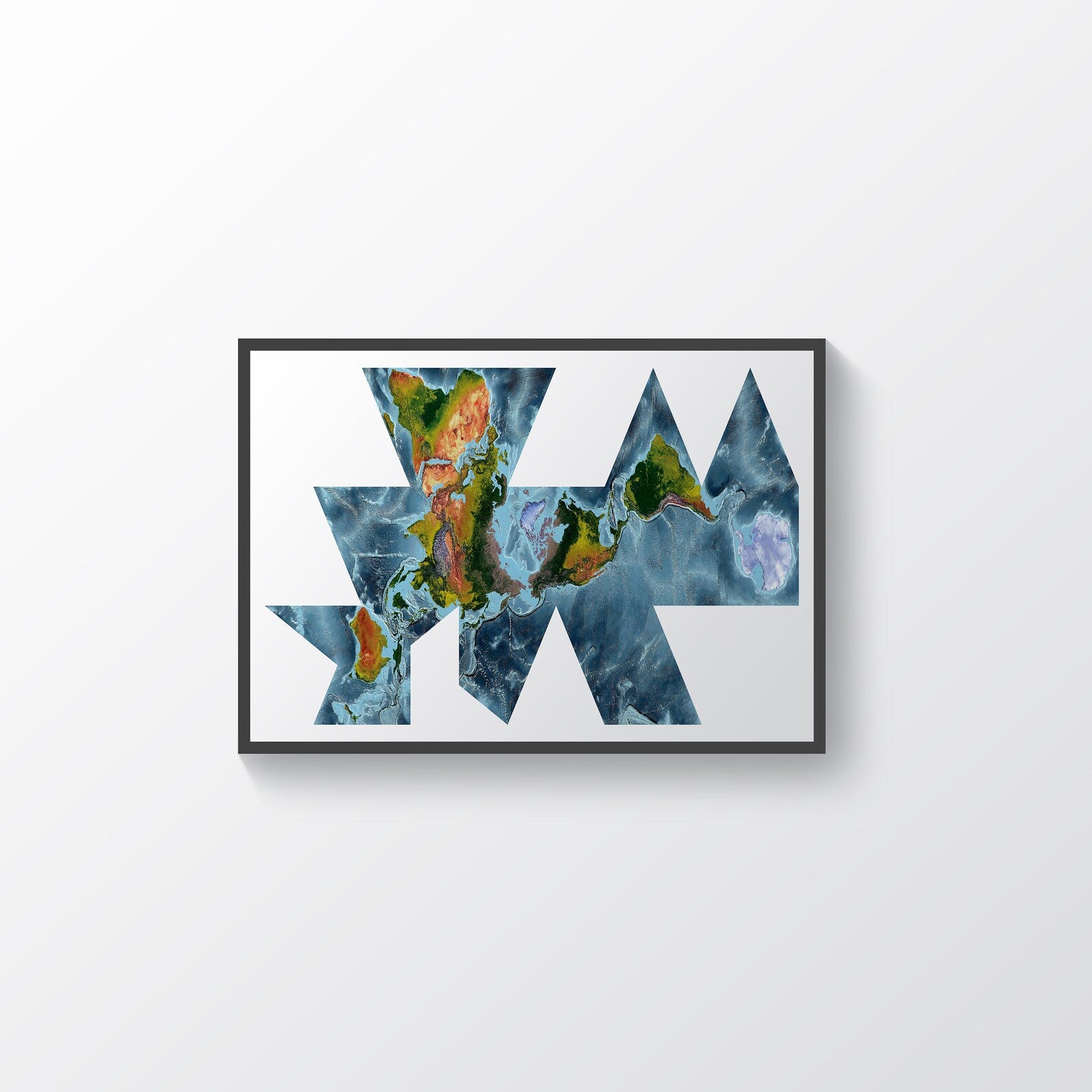 World framed shaded relief map in black frame, showing Fuller Projection. Artistic print highlighting vegetation and bathymetry