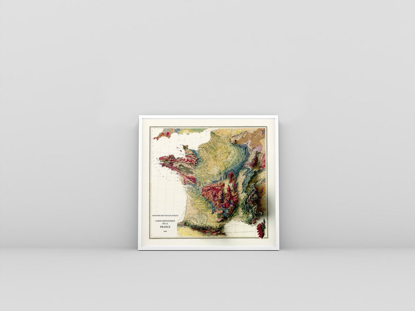 France vintage framed shaded relief map in white frame. Artistic print highlighting mountains with a realistic 3d effect