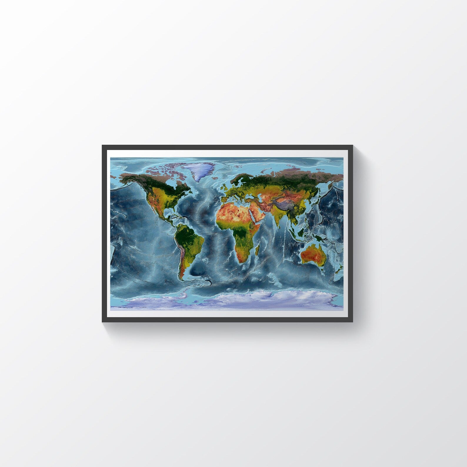 World framed shaded relief map in black frame, showing WGS84 Projection. Artistic print highlighting vegetation and bathymetry