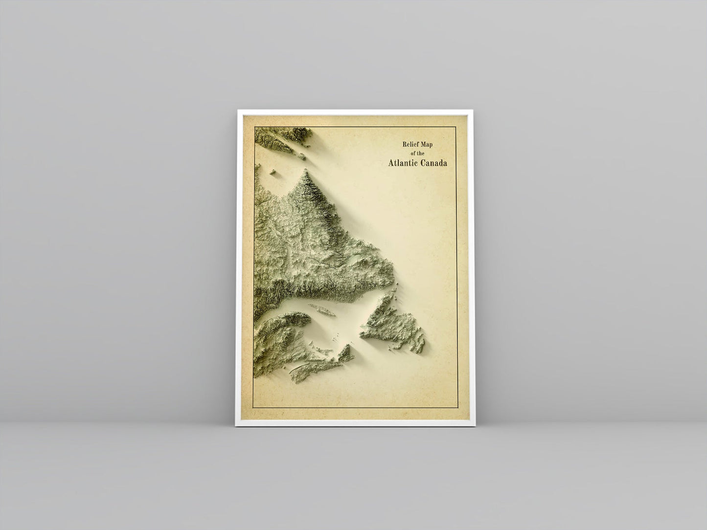 Atlantic Canada vintage framed shaded relief map in white frame. Artistic print highlighting mountains with a realistic 3d effect