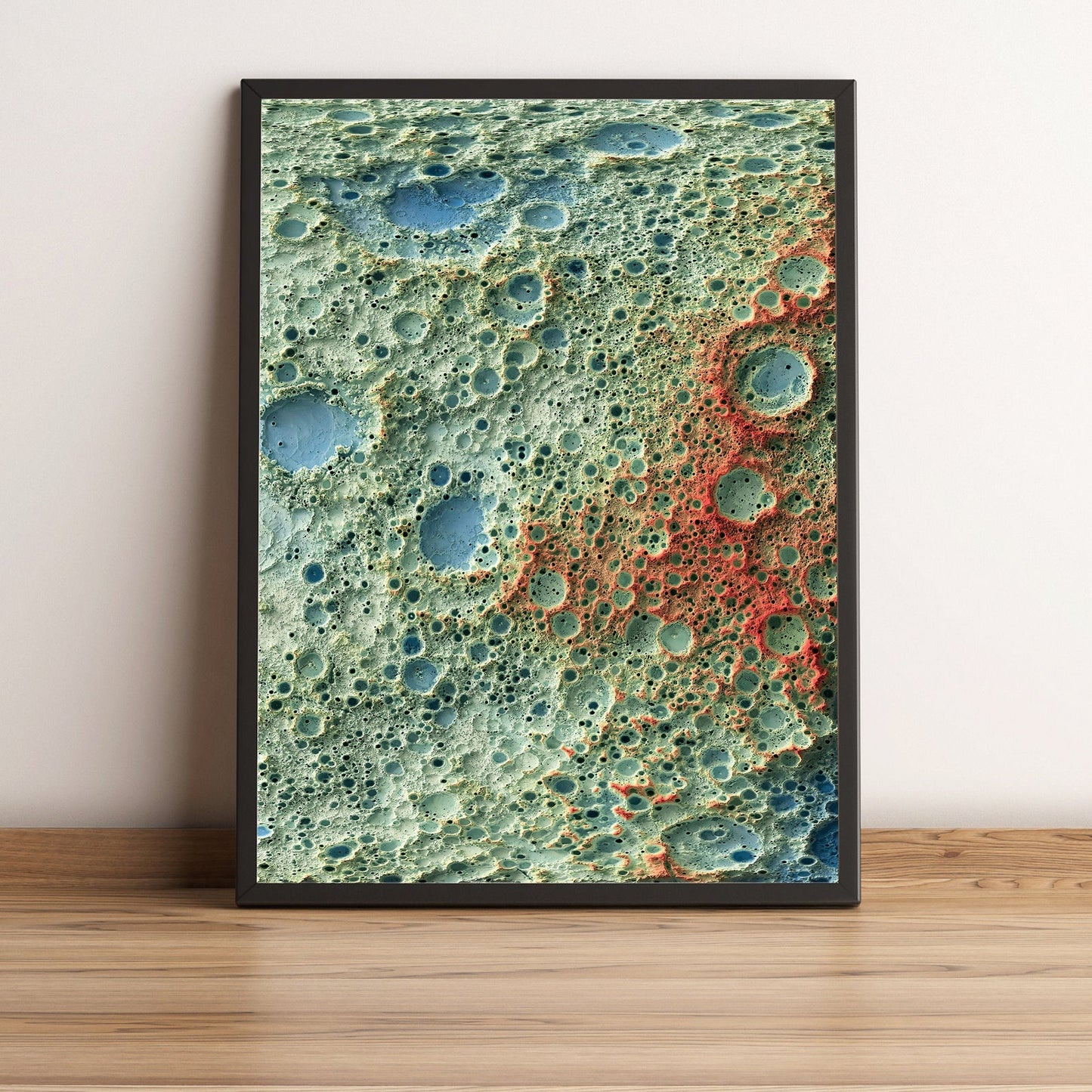 Moon framed shaded relief map in black frame. Artistic print highlighting mountains with a realistic terrain effect