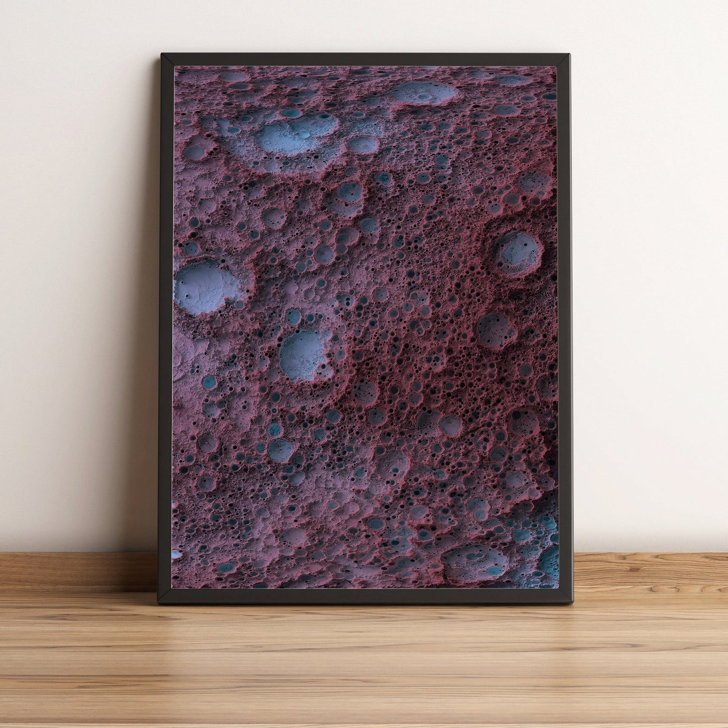 Moon framed shaded relief map in black frame. Artistic print highlighting mountains with a realistic terrain effect