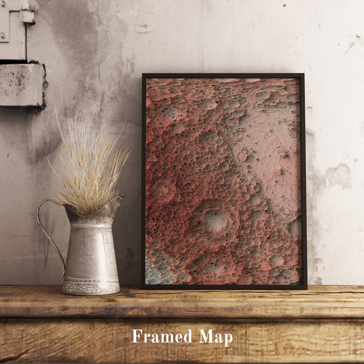 Moon shaded relief map in black frame. Realistic terrain art print for home decor, displayed on rustic wooden table