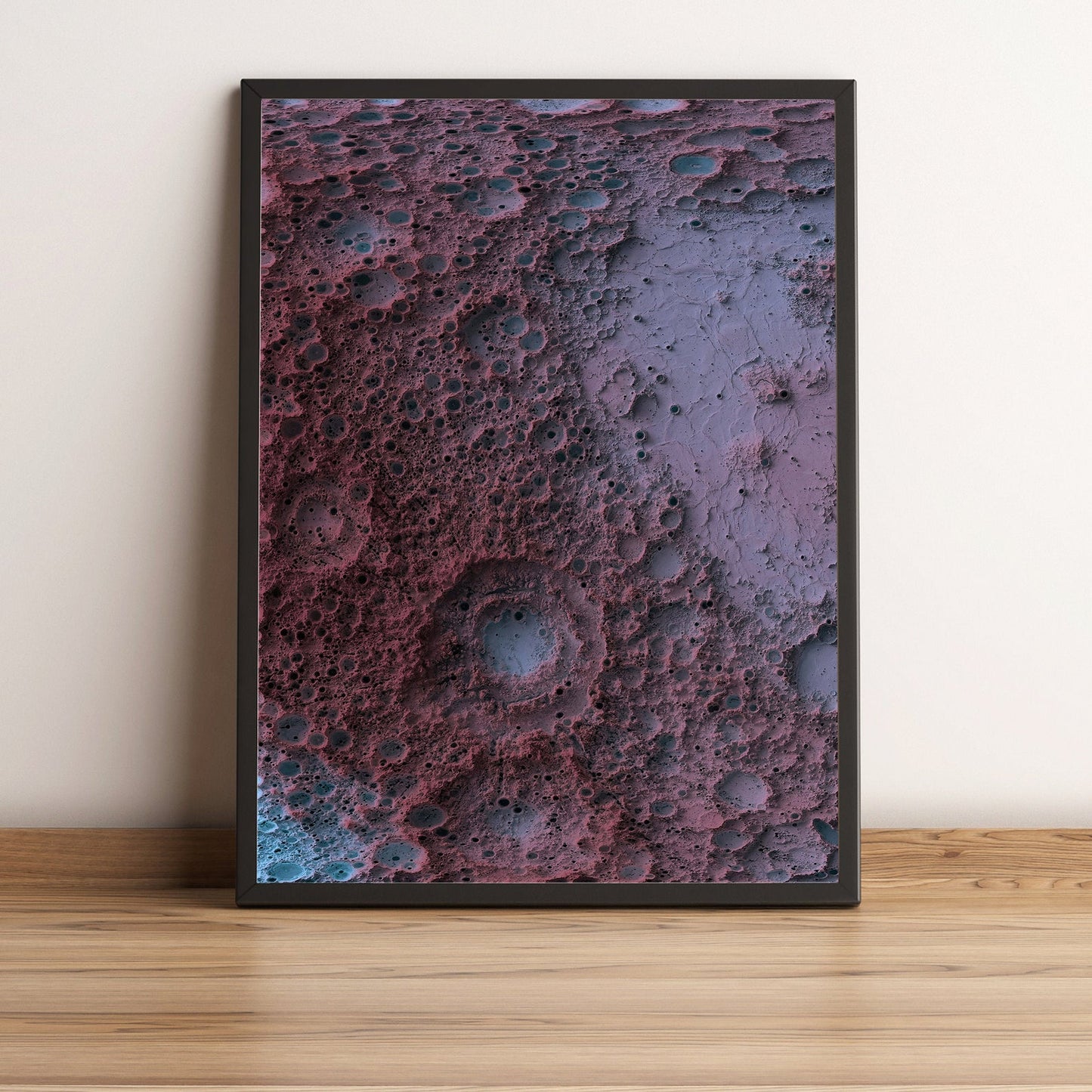 Moon framed shaded relief map in black frame. Artistic print highlighting mountains with a realistic terrain effect